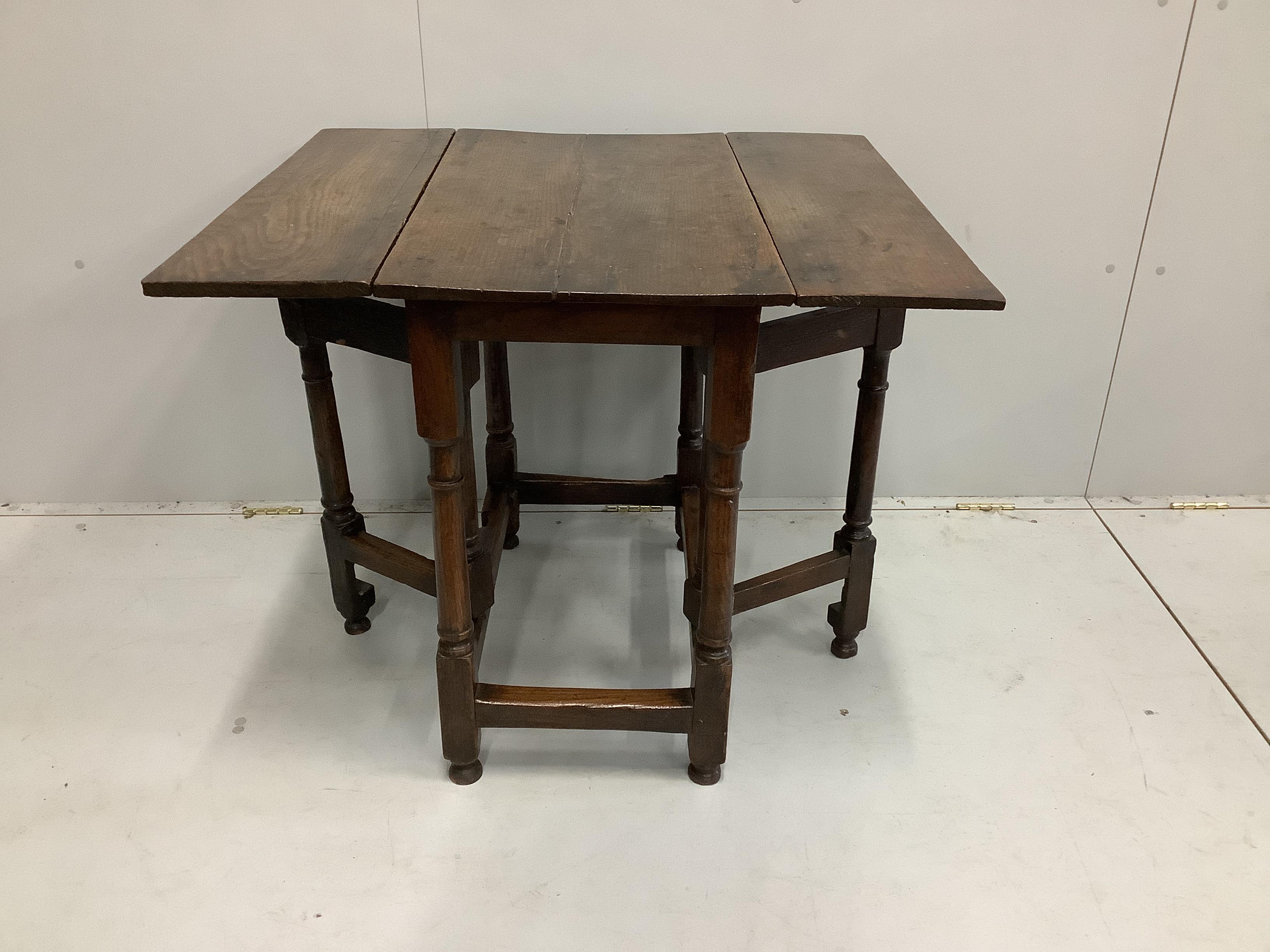An 18th century oak drop flap table, width 46cm, depth 76cm, height 72cm